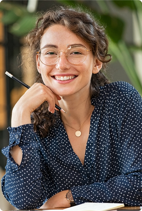 stock-photo-portrait-of-smiling-woman-wearing-spectacles-while-sitting-at-desk-business-woman-taking-notes-in-1886879992-transformed